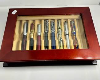 Beautiful mahogany and glass fliptop display box with eight collectible fountain and rollerball pins