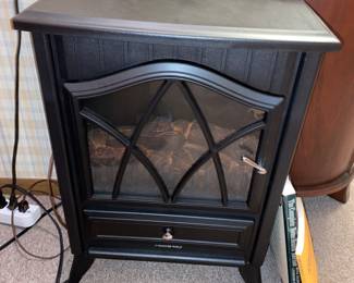 Fireplace style room heater