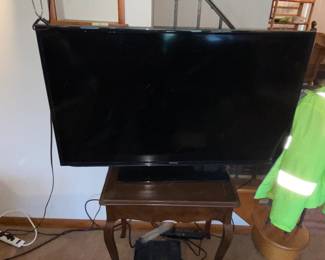 TV and 1 of 2 end tables with pullout extensions