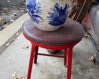 Red metal stool and flower pot