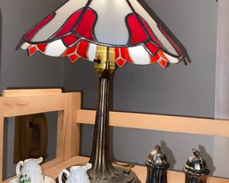 Small lamp with red and white shade