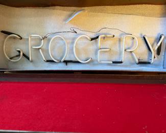 Neon grocery sign