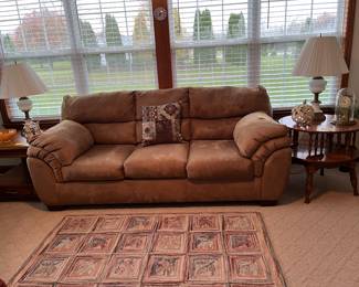 Microfiber sofa, milk glass lamps, vintage maple side table