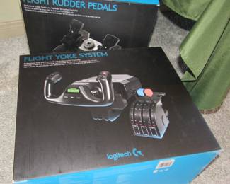 Logitech flight yoke system and flight rudder pedals. Computer too!