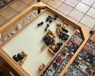 inside view of the game table pieces and storage.