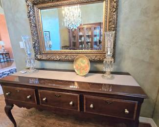 Buffet table with 3 drawers by The American Masterpiece Collection", beautiful gold framed mirror, Baccarat candelabras