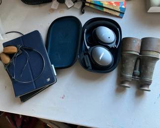 Bose headphones, antique Bardou binoculars