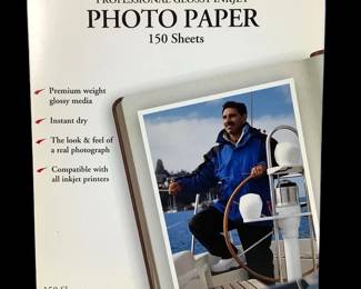 LUGR201 New Kirkland Signature Professional Glossy Inkjet Photo Paper Never been open Kirkland Signature Photo Paper, comes with 150 sheets. Each sheet is 8 1/2" x 11".
