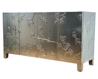 BERNHARDT HAMMERED SILVER CABINET WITH EMBOSSED FLORAL MOTIF | This modern cabinet by Bernhardt features a silver-leaf finish with embossed floral motifs across the front and sides. The four-door cabinet sits on raised legs and is constructed with clean, rectangular lines. Inside, the drawers are lined and marked with the Bernhardt brand plaque. - h. 34.5 x w. 64 x d. 20 in