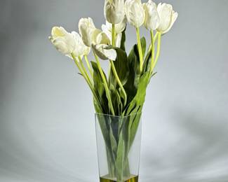 FAUX FLORAL ARRANGEMENT | Having fabric flowers in acrylic "water" in a square glass vase. - h. 26 x w. 5 x l. 5 in