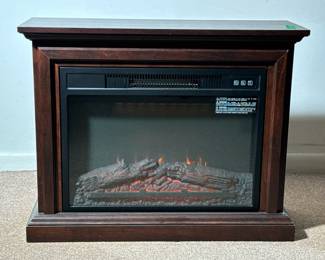 ELECTRIC FIREPLACE | A faux fireplace electric heater with remote control. - h. 25 x w. 31 x d. 11 in