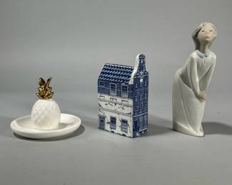 (3pc) DELFT & LLADRO | Including a Delft Holland Bel Gevel House (h. 5.5 in.), a Lladro figurine (h. 7 in.), and a pineapple form ring dish with gilt top.