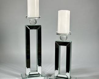 (2pc) PAIR MIRRORED CANDLESTICKS | Pair of contemporary rectangular mirrored candle votive holders with round glass tops, labeled on the bottom "The Jay Companies". - h. 17 x w. 4 x l. 6.5 in