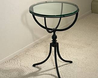 WROUGHT IRON GLASS TOP SIDE TABLE | Accent table of unusual half globe-like form, with a thick glass top on a wrought iron base with splayed legs. -  h. 24.5 x dia. 18 in