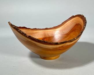KAS KIRSEBAR TURNED WOOD BOWL | Signed on the bottom, of nicely figured wood with a natural rim. - h. 5 x w. 7 x l. 9 in