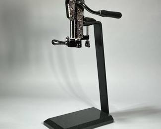 FRONTGATE TABLETOP WINE BOTTLE OPENER | Gunmetal assembly clamped to a powder-coated metal bracket with a cut stone base. - h. 23 x w. 6.5 x d. 12 in