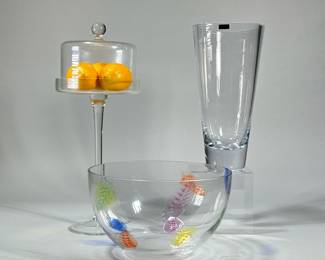(3pc) FANCY GLASS ITEMS | Including a colorful leaf-decorated fruit bowl, a tall lidded serving dish, and a Krosno Poland vase. - h. 17 in (tallest)