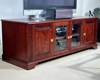 CHERRYWOOD CONSOLE CABINET | Custom built media cabinet or TV stand, of nicely figured cherry wood having two solid cabinet doors flanking a pair of double glass doors with interior storage shelves. - h. 24 x w. 67 x d. 24 in