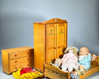 LARGE LOT DOLL ITEMS, FURNITURE & ACCESSORIES | A collection of doll-related items, including three pieces of wooden doll furniture: a wardrobe with painted floral details, a dresser with red knob handles, and a bed with matching floral decorations. The lot also features six assorted dolls in various sizes, dressed in period-style clothing, and includes additional doll clothing and accessories. The furniture is made of natural wood with painted accents, and the dolls are composed of various materials such as cloth, porcelain, and plastic. - h. 21 in (armoire)