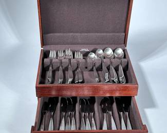 MCM “THE MAIN COURSE” STAINLESS STEEL FLATWARE SERVICE | Mid-century modern flatware set in fitted wood box. - h. 6 x w. 15 x d. 11 in (box)