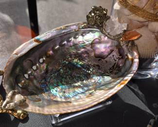 Beautiful Abalone Shell with embellishment. Comes with a stand