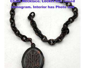 Lot 1152 Antique Tortoise Oval Locket and Chain Necklace. Locket has raised monogram. Interior has Photo and 