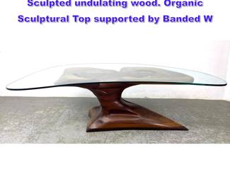 Lot 1006 Handmade Studio Dining Table. Sculpted undulating wood. Organic Sculptural Top supported by Banded W