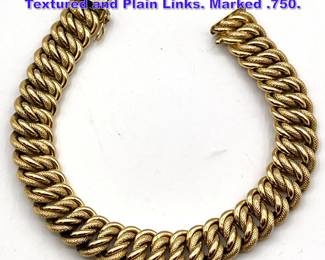 Lot 1117 18K Gold link bracelet. Interlocked Textured and Plain Links. Marked .750.