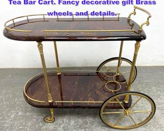 Lot 1254 ALDO TURA Lacquered Goatskin Tea Bar Cart. Fancy decorative gilt Brass wheels and details. 