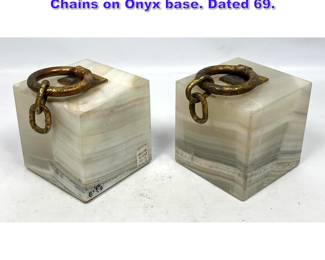 Lot 765 Unusual Pair of C Jere Bookends. Chains on Onyx base. Dated 69.