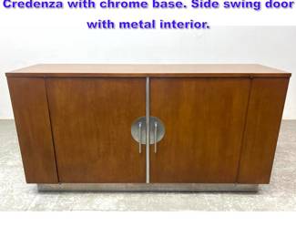 Lot 899 Walter Dorwin Teague for Hastings Credenza with chrome base. Side swing door with metal interior. 