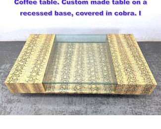 Lot 893 KARL SPRING Cobra Snake skin Coffee table. Custom made table on a recessed base, covered in cobra. I