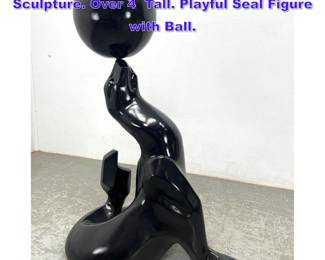 Lot 1069 Large Black Fiberglass Seal Sculpture. Over 4 Tall. Playful Seal Figure with Ball. 