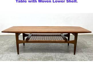 Lot 702 Moreddi Danish Modern Teak Coffee Table with Woven Lower Shelf. 