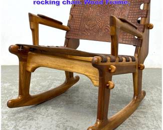 Lot 1011 Angel Pazmino tooled leather rocking chair. Wood Frame. 
