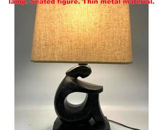 Lot 1672 Frederick Weinberg style table lamp. Seated figure. Thin metal material.