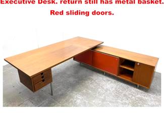 Lot 1871 George Nelson Herman Miller Executive Desk. return still has metal basket. Red sliding doors.