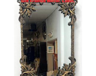 Lot 1995 UTTERMOST Decorative Foliate Gilt Framed Mirror. Label.