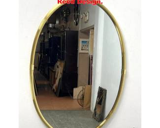 Lot 1951 Brass Oval wall Mirror. Reed Design.