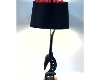 Lot 1738 Tall Abstract rams head lamp. African style.
