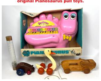 Lot 2121 5pcs Children s Toys, including an original Pianosaurus pull toys.