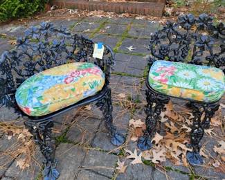 Pair of cast iron garden chairs with custom cushions