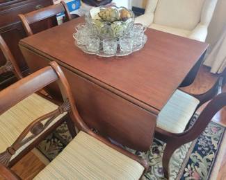 Duncan Phyfe table with 4 chairs and Tiffin Franciscan Moon and Stars punch bowl and cups