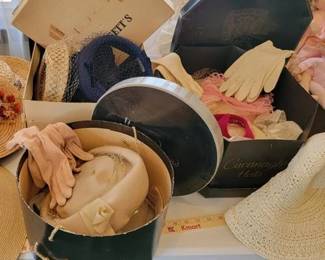 Vintage hats and gloves in hat boxes
