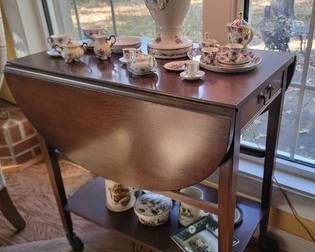 Vintage mahogany tea cart and porcelain lamp decor