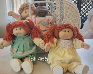 Cabbage Patch Dolls and wicker basket