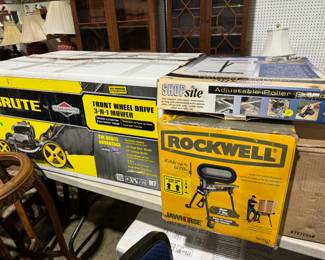 NIB lawnmowers, tools, cookers, parts washer...rolling storage racks 