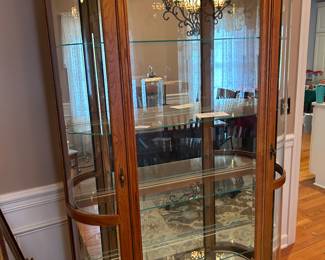 Amazing Curio Cabinet - we’ve all seen them, just not like this.  Lovely Wood, Glass Shelves and Mirrored Back, 2 Lights on Top.  Perfect Condition!