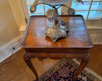 Antique epergne on small ball and claw side table