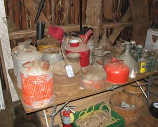 All sorts of old metal cans and funnels, fire extinguisher, rope